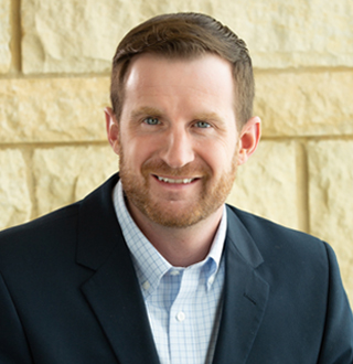 Headshot of Andrew Essay