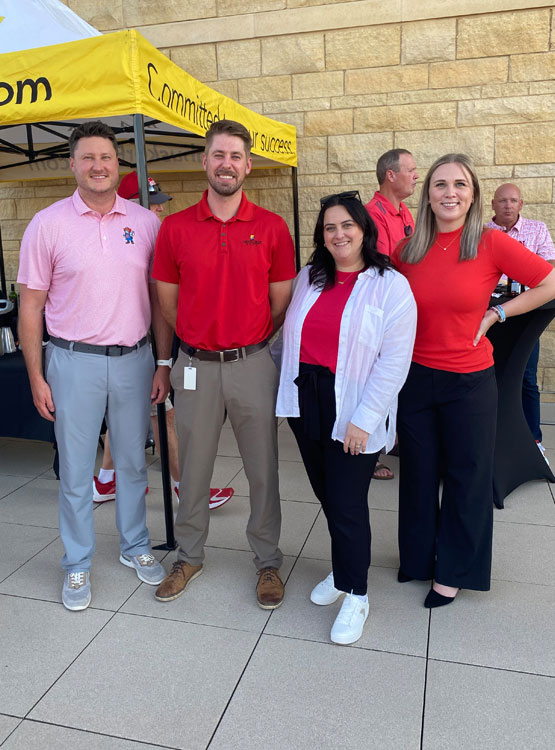 Group of staff at our 2025 Husker Tailgate event. 